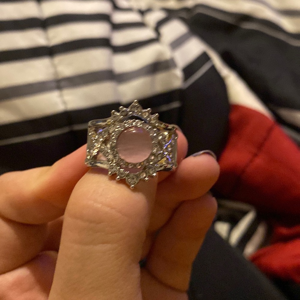 Pink cat eye with white stones.